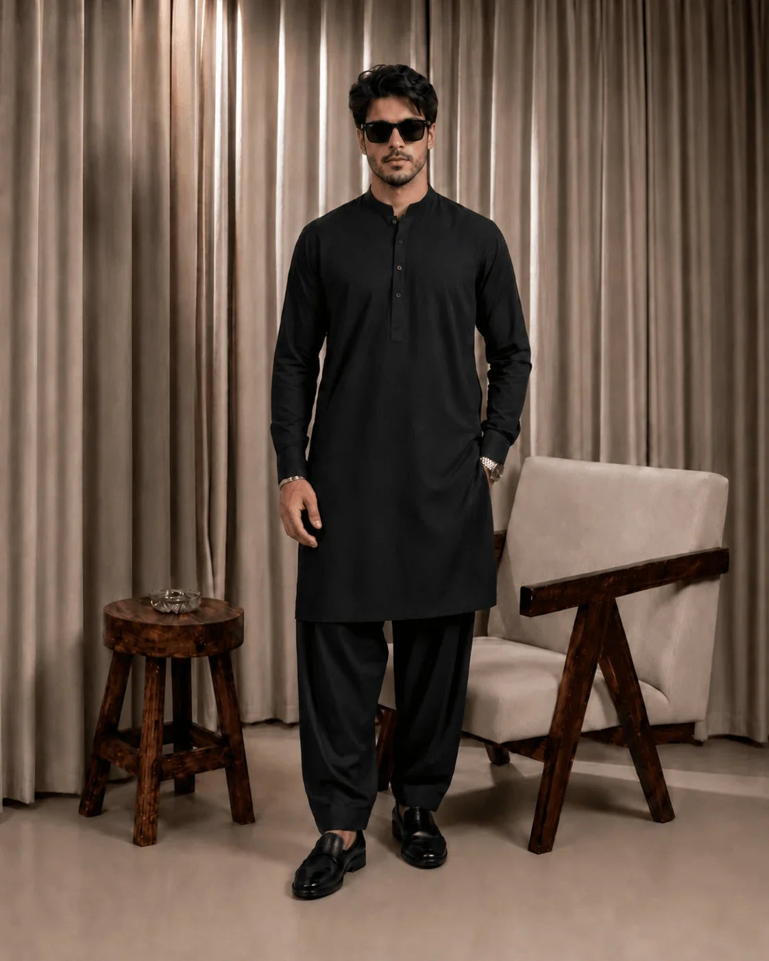 Men's black unstitched suiting fabric for formal and festive wear, styled as a kurta set with trousers.
